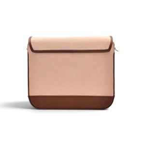A minimalist rectangular crossbody / shoulder bag by needlesay with a light blush pink denim body, a dark brown leather bottom panel, and a matching dark brown trim on the flap, shown against a plain white background.