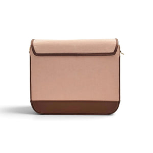 Needlesay minimalist rectangular denim shoulder bag with a flap closure, featuring a dusty rose pink denim body and dark brown trim leather, set against a plain white background.