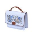 Needlesay Ivory white embroidered denim handbag angled side view