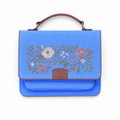 Needlesay Azure blue embroidered denim handbag front view