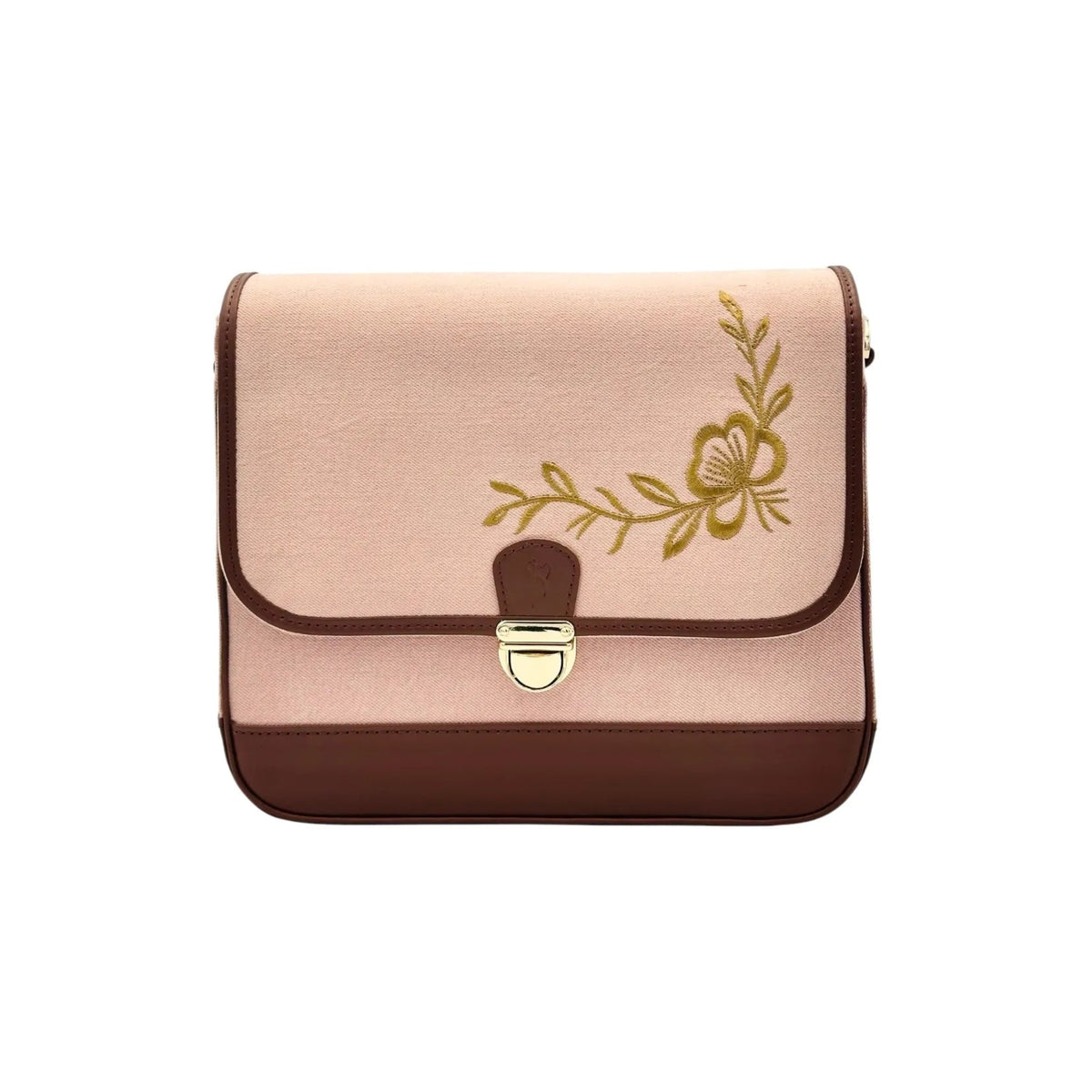A rectangular flap shoulder bag by needlesay collection called botanica blush in blush pink denim and dark brown genuine leather, featuring a gold floral vine design on the front flap and a gold-tone metal clasp.