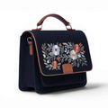 Needlesay Noir black embroidered denim handbag angled side view