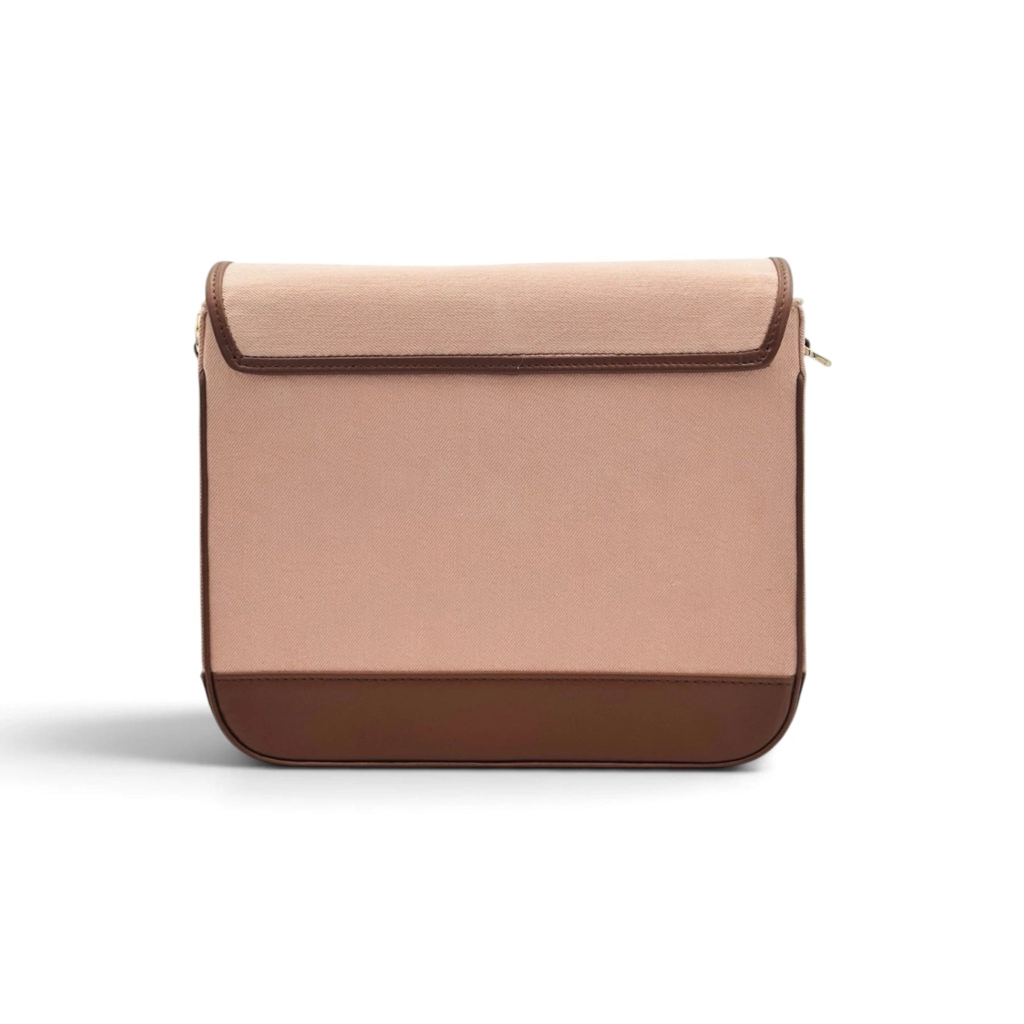 Needlesay minimalist rectangular denim shoulder bag with a flap closure, featuring a dusty rose pink denim body and dark brown trim leather, set against a plain white background.