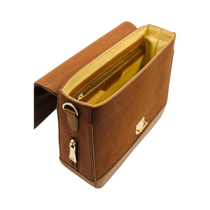 A brown denim sholder bag by needlsay collection called botanica cocoa shown open from an elevated angle, revealing a bright yellow interior lining and gold-tone hardware, set against a plain white background.
