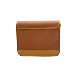 A rectangular shoulder bag y needlsay collection called cocoa with a two-tone color-blocked design, featuring a  brown denim body, a tan suede flap, and a mustard yellow leather base, shown against a plain white background.