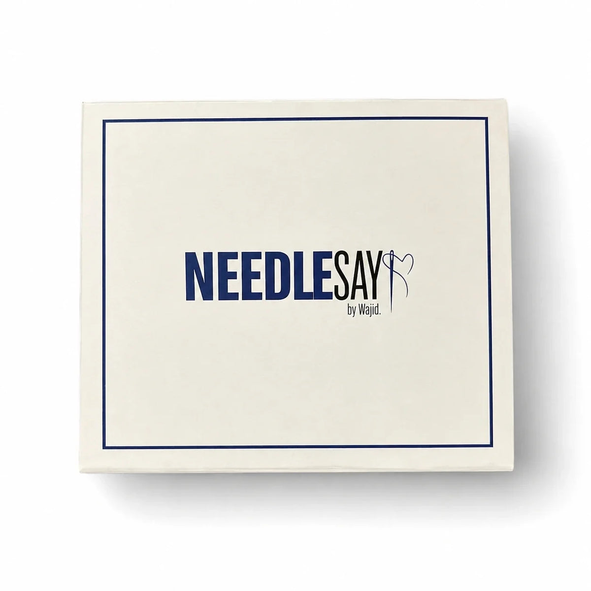 Needlesay signature gift box, cream with navy trim and logo, closed